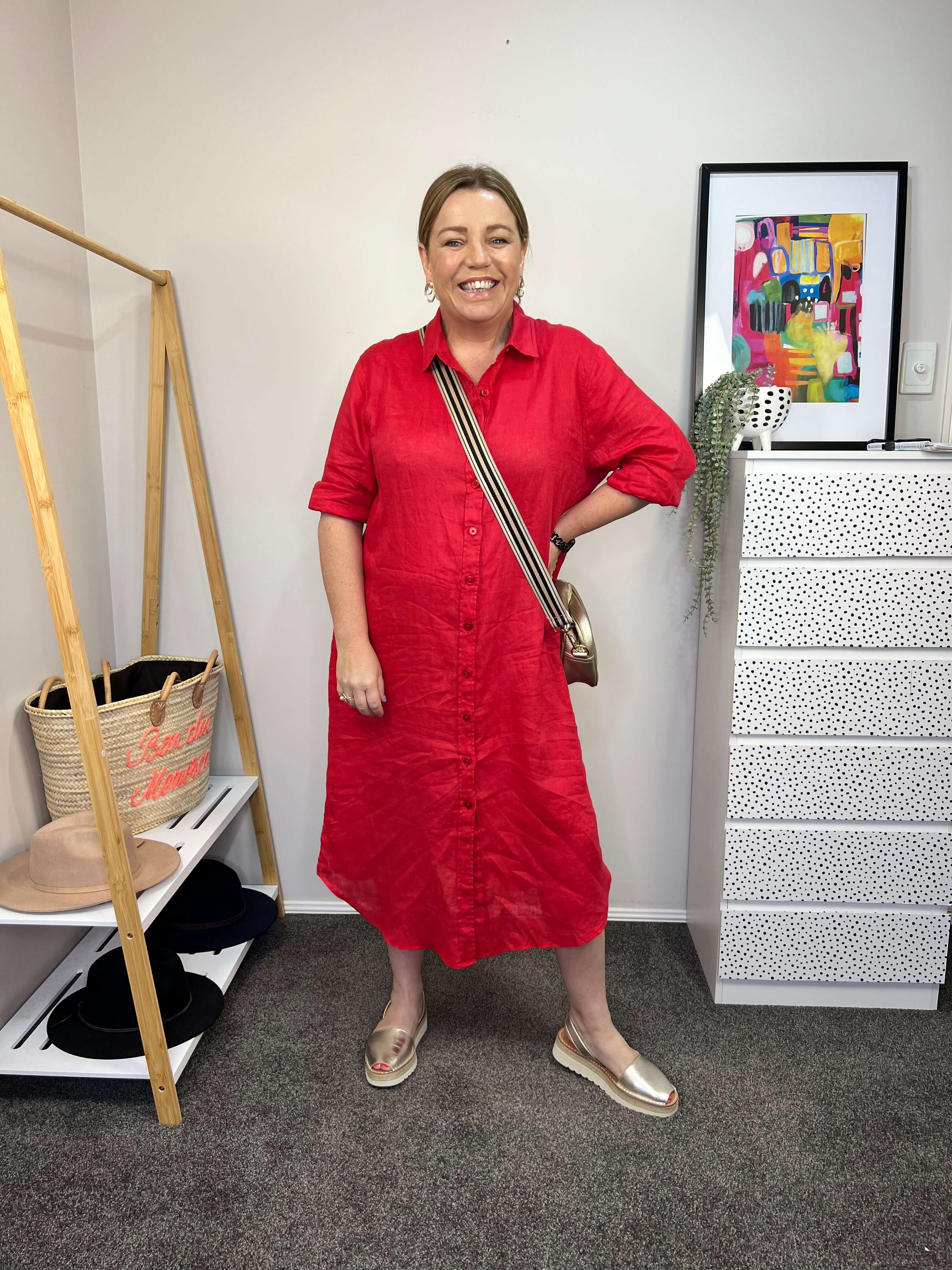 pink red button down linen dress with golden accessories